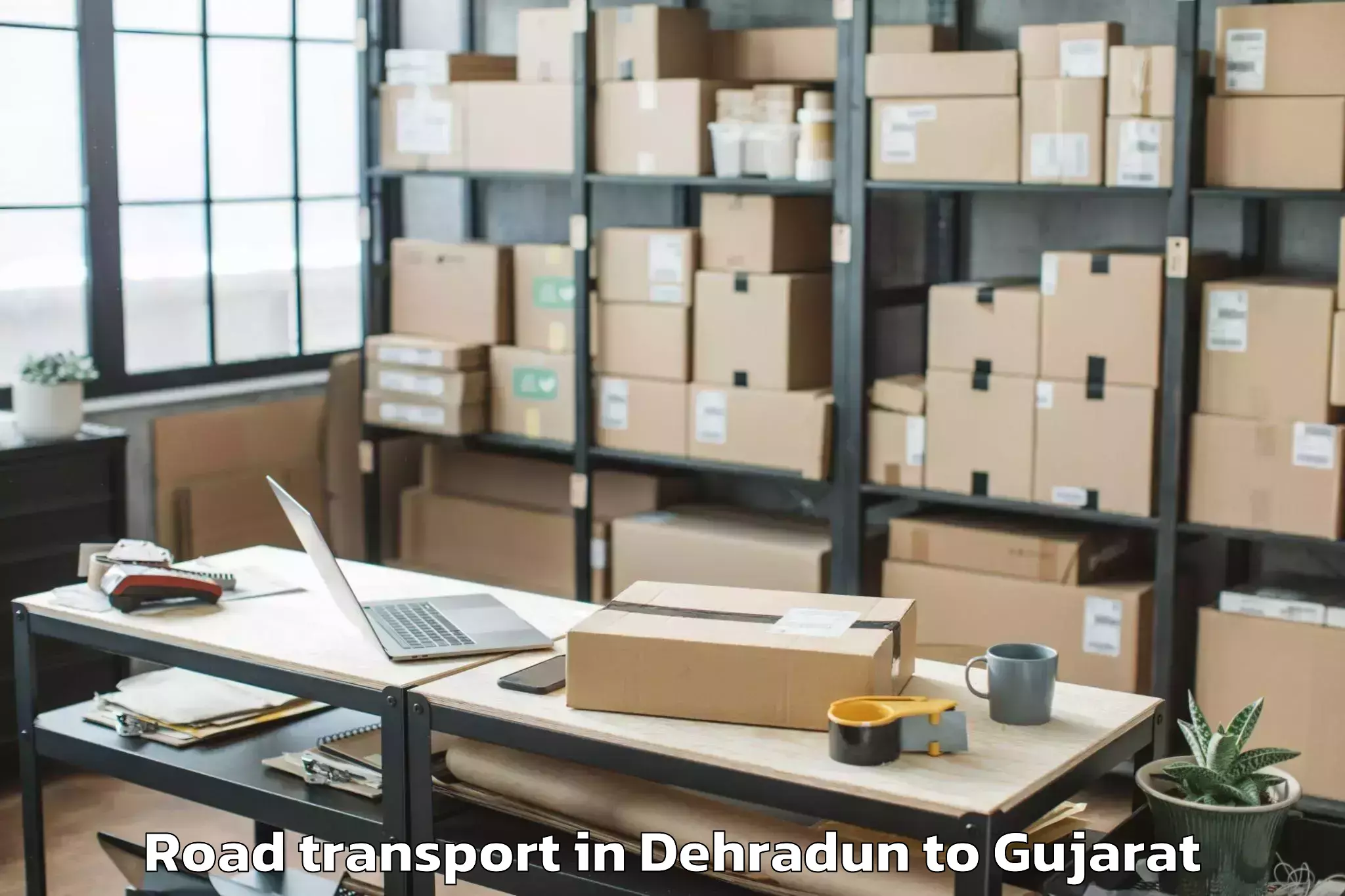 Book Your Dehradun to Keshod Airport Ixk Road Transport Today